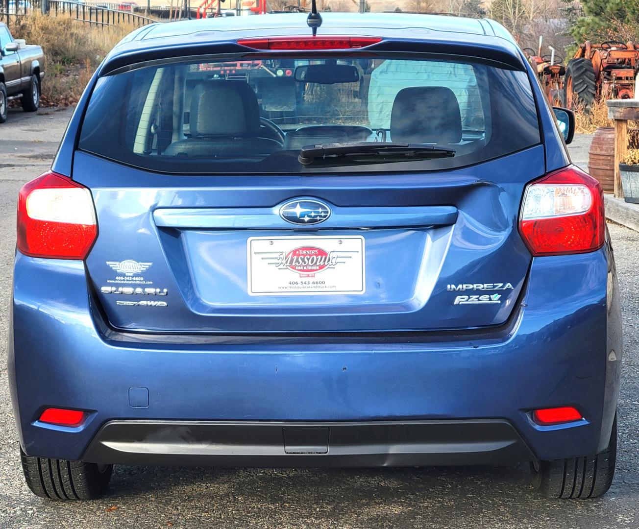 2012 Blue /Black Subaru Impreza Limited 5-Door (JF1GPAG65CH) with an 2.0L H4 DOHC 16V engine, Continuously Variable Transmission transmission, located at 450 N Russell, Missoula, MT, 59801, (406) 543-6600, 46.874496, -114.017433 - Good Runner. Excellent MPG. Automatic Transmission. Heated Seats. Air. Cruise. Tilt. Bluetooth. has Timing Chain. Not a Timing Belt. - Photo#4